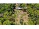Aerial view of property surrounded by lush greenery and trees at 6990 Richardson Rd, Sarasota, FL 34240