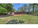 Enjoy outdoor living on the brick patio in the spacious backyard with mature trees at 6990 Richardson Rd, Sarasota, FL 34240