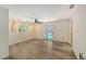 Bright bedroom with modern ceiling fan, a sliding glass door to a pool, and stylish flooring at 6990 Richardson Rd, Sarasota, FL 34240