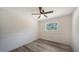 A bright bedroom features new flooring and a window at 6990 Richardson Rd, Sarasota, FL 34240