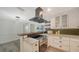 Stylish kitchen featuring modern appliances, marble countertops, and backsplash, with open floor plan at 6990 Richardson Rd, Sarasota, FL 34240