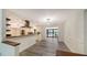 An open view of the gourmet kitchen that features stainless appliances and modern countertops at 6990 Richardson Rd, Sarasota, FL 34240