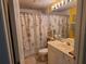 Bathroom featuring a vanity with a sink and seashell themed shower curtain at 7273 Cedar Hollow Cir # 102, Bradenton, FL 34203