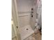 Bathroom shower stall with built-in shelving and grab bar for added safety and convenience at 7273 Cedar Hollow Cir # 102, Bradenton, FL 34203