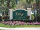 Tara Golf and Country Club private entrance sign with manicured flower beds at 7273 Cedar Hollow Cir # 102, Bradenton, FL 34203