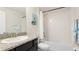Well-lit bathroom featuring granite countertops, a shower and tub, and coastal decor at 7379 47Th Avenue E Cir, Bradenton, FL 34203