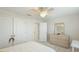 Bright bedroom featuring a large closet, a dresser, and a comfortable bed at 7379 47Th Avenue E Cir, Bradenton, FL 34203