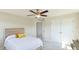 Comfortable bedroom with a ceiling fan, a large closet, and a natural light at 7379 47Th Avenue E Cir, Bradenton, FL 34203