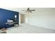 Bright bonus room featuring plush carpets, a neutral color palette, and a modern ceiling fan at 7379 47Th Avenue E Cir, Bradenton, FL 34203