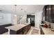 Modern kitchen with granite countertops, stainless steel appliances, and a spacious center island at 7379 47Th Avenue E Cir, Bradenton, FL 34203