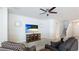 Comfortable living room with plush seating, a ceiling fan, and a large television for entertainment at 7379 47Th Avenue E Cir, Bradenton, FL 34203