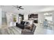 Open-concept living space seamlessly connects to the kitchen and dining area, filled with natural light at 7379 47Th Avenue E Cir, Bradenton, FL 34203