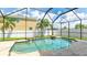 Relaxing screened-in pool area with crystal-clear water and beautiful paver deck at 7379 47Th Avenue E Cir, Bradenton, FL 34203