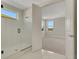Bright bathroom with a glass enclosed shower and view into bedroom at 7533 Nighthawk Drive, Sarasota, FL 34241