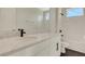Bathroom vanity features gray and white stone counters with dark hardware at 7533 Nighthawk Drive, Sarasota, FL 34241