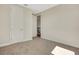 Neutral bedroom with carpeted floors, large windows and access to hall at 7533 Nighthawk Drive, Sarasota, FL 34241
