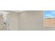Neutral bedroom with tile floors leading into bathroom at 7533 Nighthawk Drive, Sarasota, FL 34241