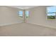 Spacious bedroom with carpeted floors and natural light at 7533 Nighthawk Drive, Sarasota, FL 34241