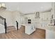 Well-lit kitchen with white cabinetry, stainless steel appliances, and an island with a quartz countertop at 7533 Nighthawk Drive, Sarasota, FL 34241
