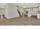 Spacious open-concept living space leading to a modern kitchen and a staircase to the second floor at 7533 Nighthawk Drive, Sarasota, FL 34241