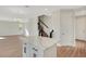 Open concept living space with a view of the kitchen island, stairs, and dining area at 7533 Nighthawk Drive, Sarasota, FL 34241