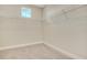 Walk-in closet with carpeted floors and metal shelving at 7533 Nighthawk Drive, Sarasota, FL 34241