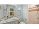 Stylish bathroom features a marble vanity, tiled shower, and modern fixtures at 755 Edgemere Ln, Sarasota, FL 34242