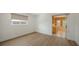Neutral bedroom with a large window and wood-look floors; offers ample natural light at 755 Edgemere Ln, Sarasota, FL 34242