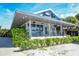 Charming Summer House restaurant exterior featuring a sleek design, lush greenery, and inviting outdoor dining at 755 Edgemere Ln, Sarasota, FL 34242