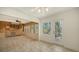Bright sun room features multiple windows, and access to the backyard and other living spaces at 755 Edgemere Ln, Sarasota, FL 34242