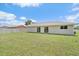 Exterior of home with large backyard that is fenced in and siding at 7595 Berwick St, North Port, FL 34287