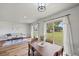 Bright dining area with sliding glass doors that open to the backyard at 7595 Berwick St, North Port, FL 34287