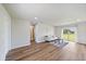 Cozy living room featuring wood flooring and a neutral color palette at 7595 Berwick St, North Port, FL 34287