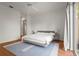 Bright bedroom with a ceiling fan, outdoor views, and a plush rug at 7716 Uliva Way, Sarasota, FL 34238
