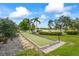 Enjoy a game of bocce ball on the well-maintained court with scenic lake views at 7716 Uliva Way, Sarasota, FL 34238