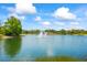 Beautiful community lake with a fountain at 7716 Uliva Way, Sarasota, FL 34238