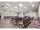 Meeting room featuring neat rows of purple chairs, bright lighting, and an exit to the exterior at 7716 Uliva Way, Sarasota, FL 34238