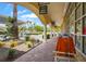 Covered walkway of the Village Walk shopping area with boutique storefronts and lush landscaping at 7716 Uliva Way, Sarasota, FL 34238