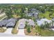 Aerial view showcasing the home's landscaping, mature trees, and neighborhood at 7834 38Th E Ct, Sarasota, FL 34243