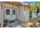 Inviting front entrance featuring double doors, arched windows, and well-manicured landscaping with decorative gravel at 7834 38Th E Ct, Sarasota, FL 34243