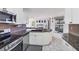 Well-equipped kitchen featuring granite countertops, stainless steel appliances, and ample cabinet space at 7834 38Th E Ct, Sarasota, FL 34243