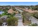 Stunning aerial view of a serene neighborhood with palm trees and well-manicured lawns at 8222 Haven Harbour Way, Bradenton, FL 34212