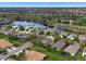 Gorgeous aerial view of a lakeside community with well-manicured lawns and beautiful single-Gathering homes at 8222 Haven Harbour Way, Bradenton, FL 34212