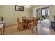 Cozy dining area with a glass-top table and access to outdoor patio at 8222 Haven Harbour Way, Bradenton, FL 34212