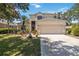 Charming two-story home featuring a well-manicured lawn, two car garage and a driveway with space for multiple cars at 8222 Haven Harbour Way, Bradenton, FL 34212