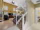 Bright foyer showcasing a staircase leading to the second floor and an open view of the living area at 8222 Haven Harbour Way, Bradenton, FL 34212