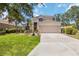 Charming two-story home with a well-maintained lawn, beautiful landscaping, and a two-car garage at 8222 Haven Harbour Way, Bradenton, FL 34212