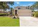 Charming two-story home with a well-maintained lawn, beautiful landscaping, and a two-car garage at 8222 Haven Harbour Way, Bradenton, FL 34212