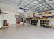 Spacious garage with ample storage, shelving, work space, and garage door at 8222 Haven Harbour Way, Bradenton, FL 34212