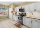 Bright kitchen with white cabinets, stainless steel appliances and granite counters at 8222 Haven Harbour Way, Bradenton, FL 34212